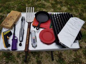 Thermometers, GrillGrates, tongs, spatula, lighter and my cast iron skillet steak weight